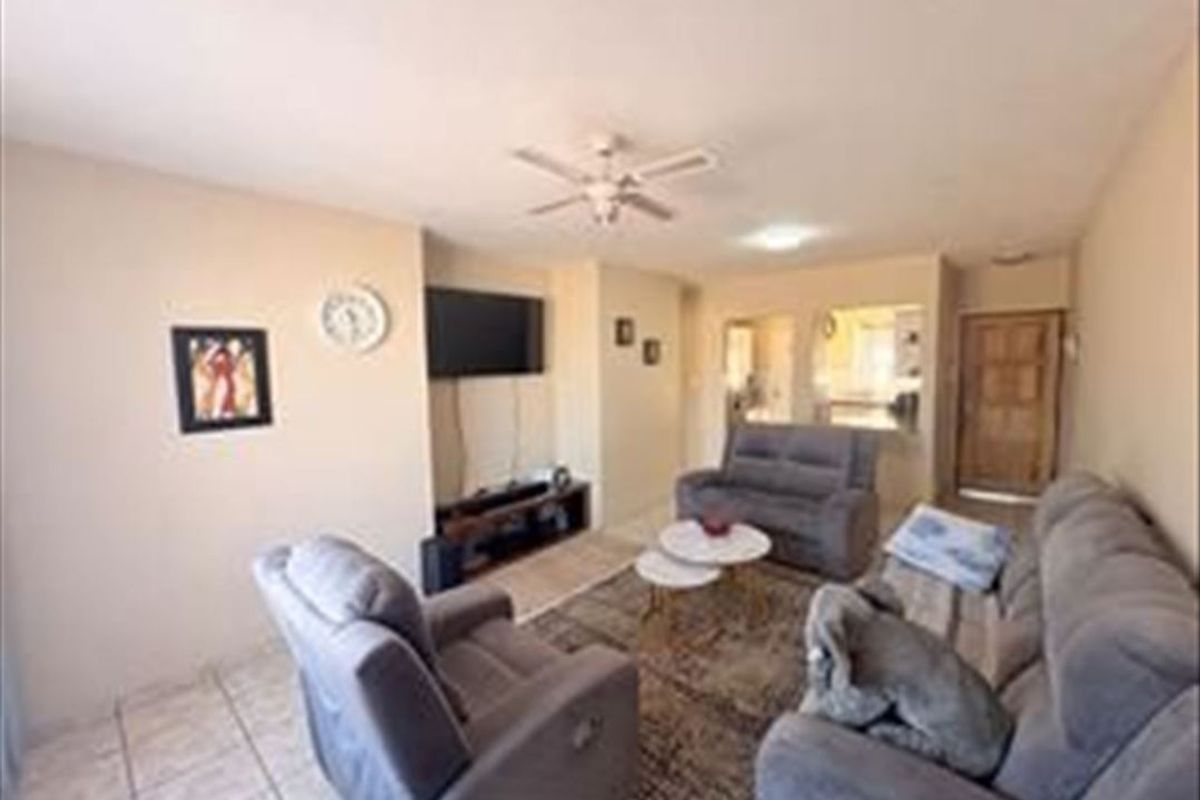 Charming 3-Bedroom Home with Functional Layout and Carport - Photo 2