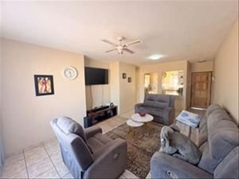 Charming 3-Bedroom Home with Functional Layout and Carport - Photo 2