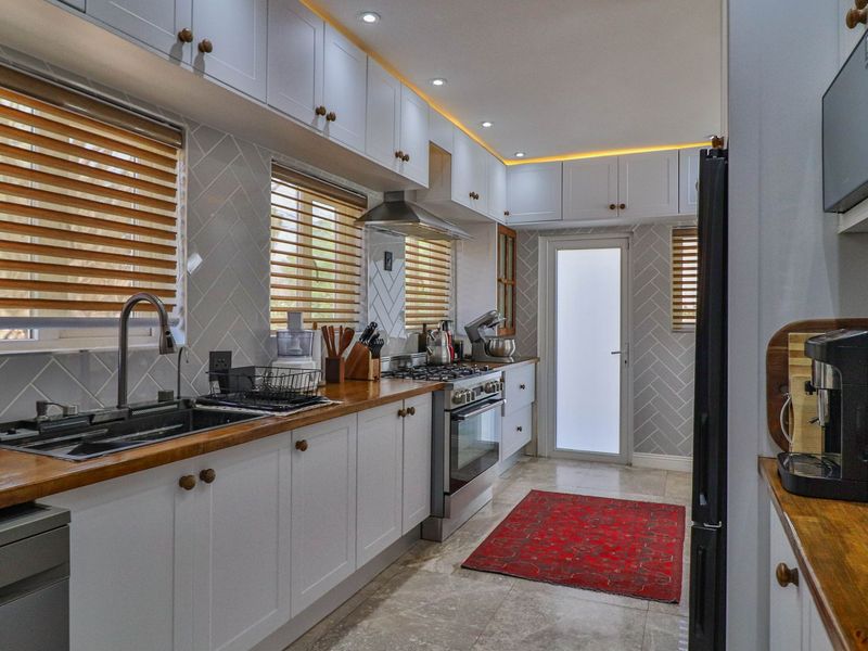 Stylish 4-Bedroom Home in Sought-After Boomed Area of Highway Gardens. - Photo 9