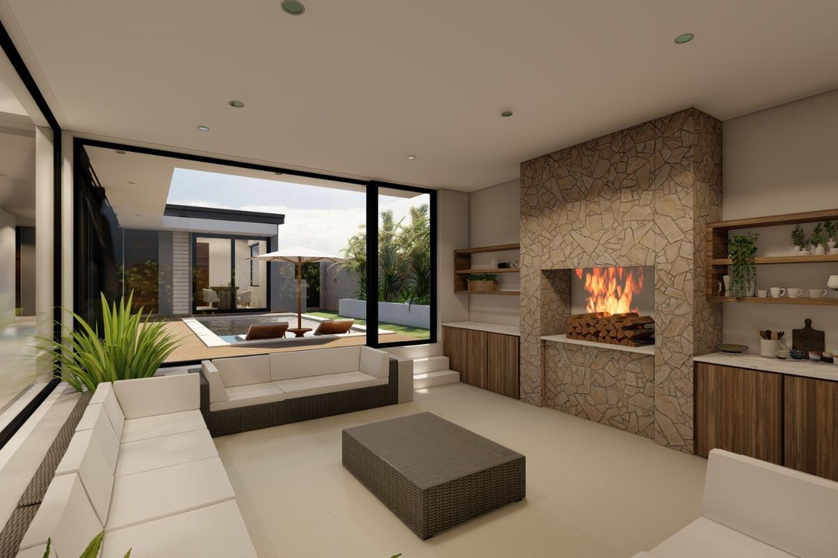 Modern open-plan living area featuring a stone-clad fireplace, built-in cabinetry, and large sliding doors opening onto a pool deck.