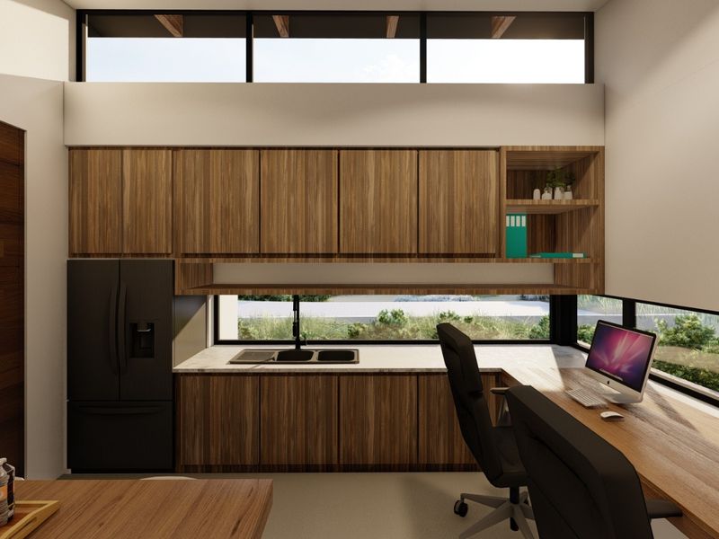 Modern kitchen featuring wood-grain cabinetry, integrated appliances, and a built-in workspace with expansive windows overlooking the exterior landscape.