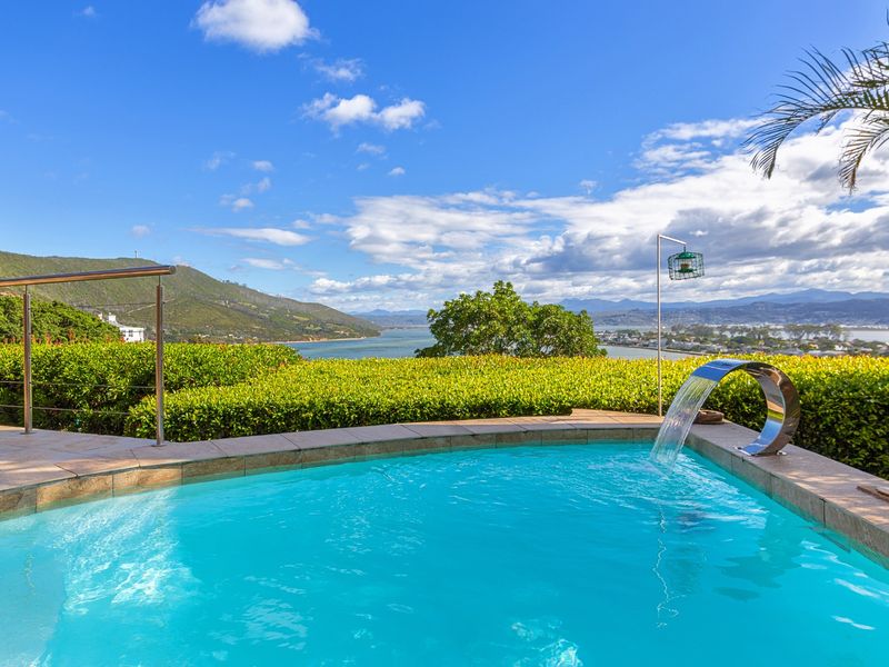 Follow the sun and enjoy this warm and sunny Knysna Heads home - Photo 1