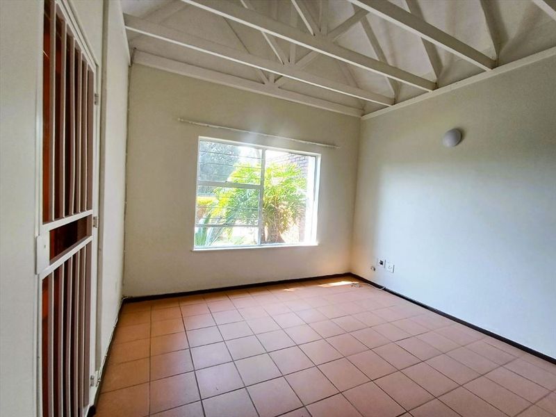 Cozy Two-Bedroom Home with Pool and Carport - Photo 2