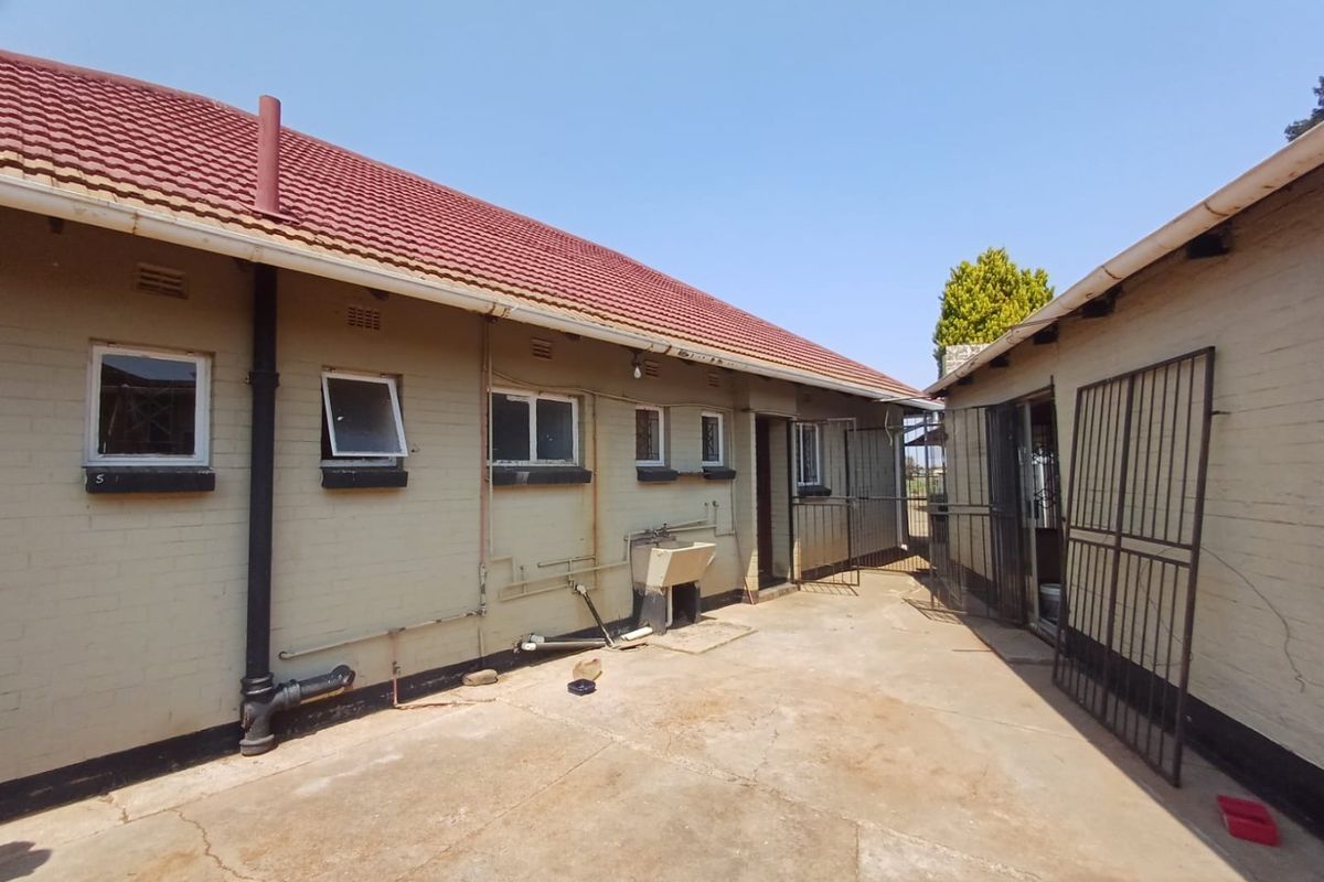Charming Three-Bedroom Home with Income-Generating Flatlet in Stilfontein Ext 4 - Photo 4