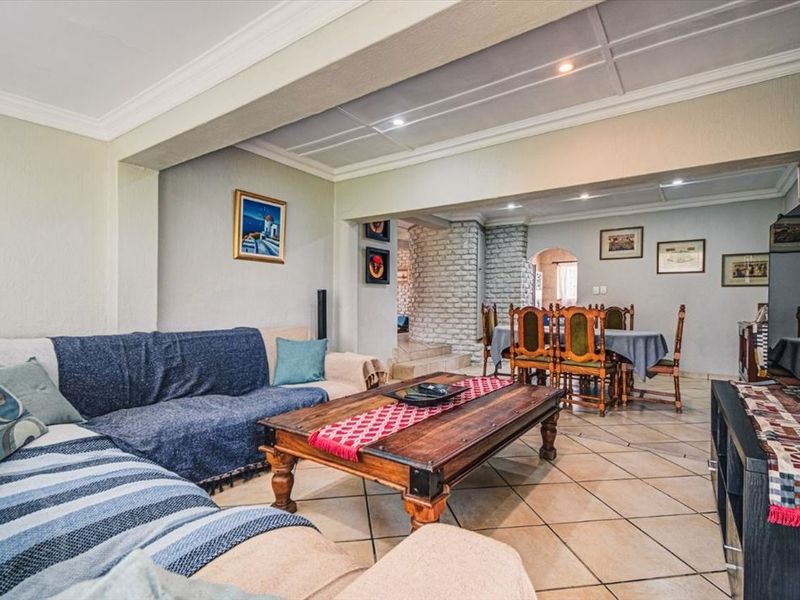 Elegant 3-Bedroom Home with Multiple Living Areas and 5-Car Carport - Photo 2