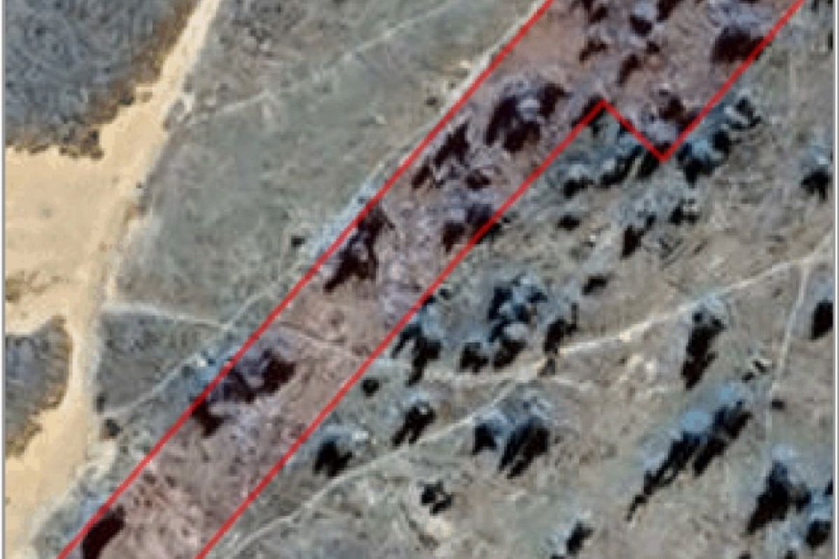 An aerial satellite view showing the boundary outline of a vacant residential land plot.