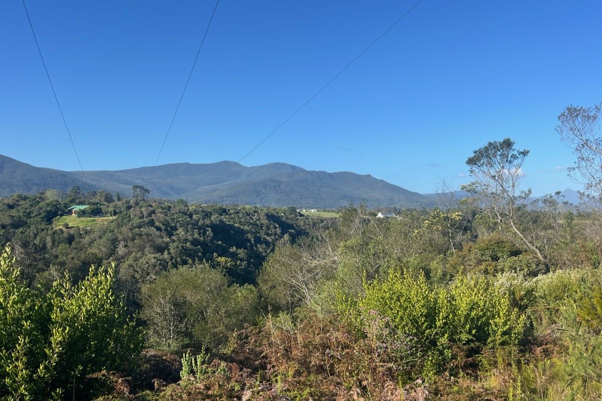 A scenic view of the surrounding mountain range and natural landscape, showcasing the property's elevated position and natural surroundings.