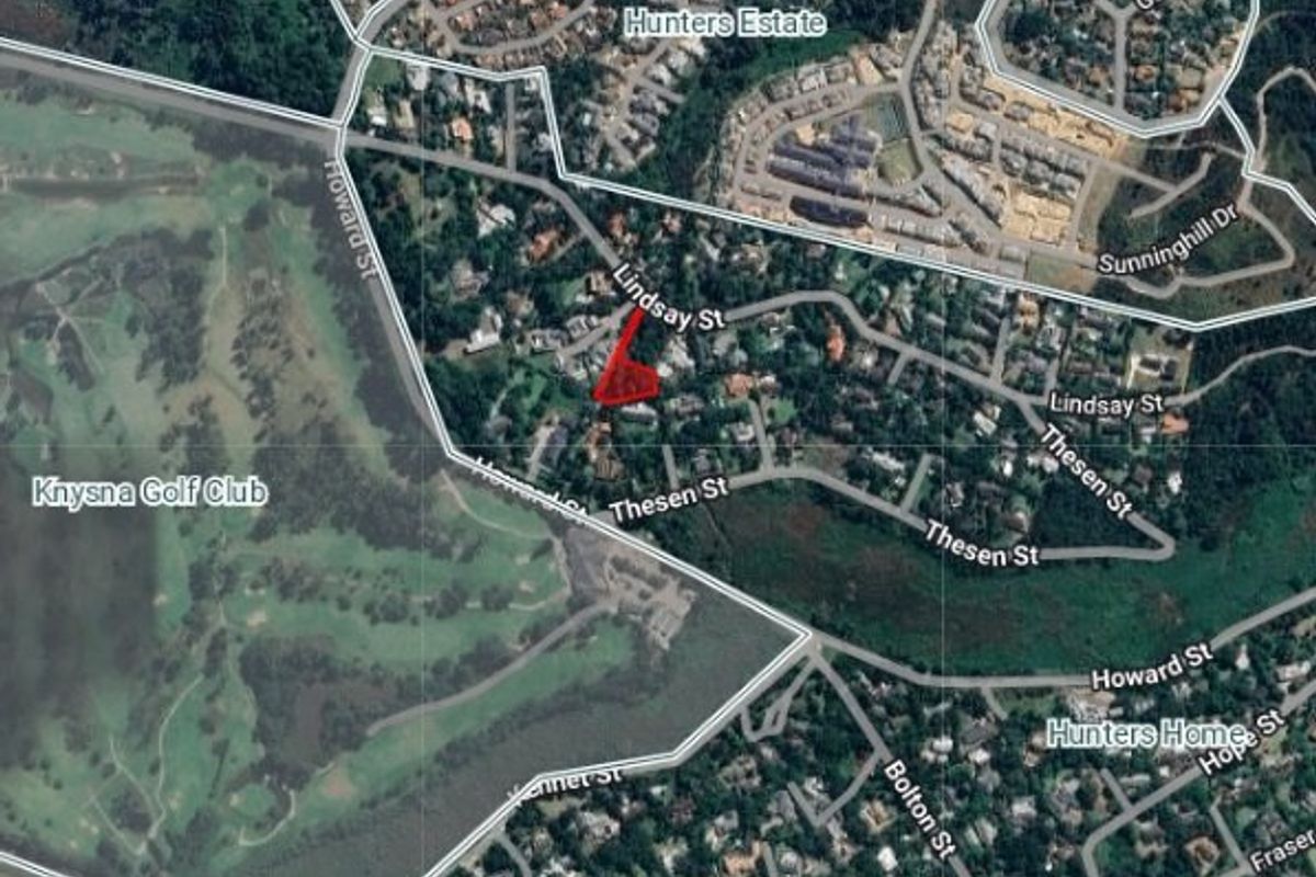 Aerial view showing the location and boundaries of the residential land parcel within the surrounding neighborhood.