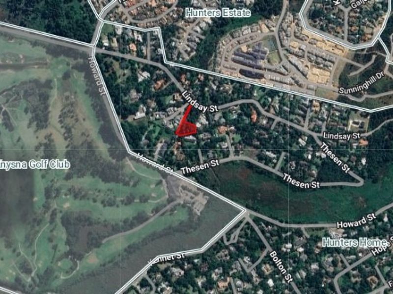 Aerial view showing the location and boundaries of the residential land parcel within the surrounding neighborhood.