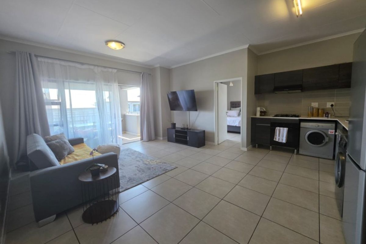 Modern 1-Bedroom Flat with Extended Balcony and Pool Access - Photo 2