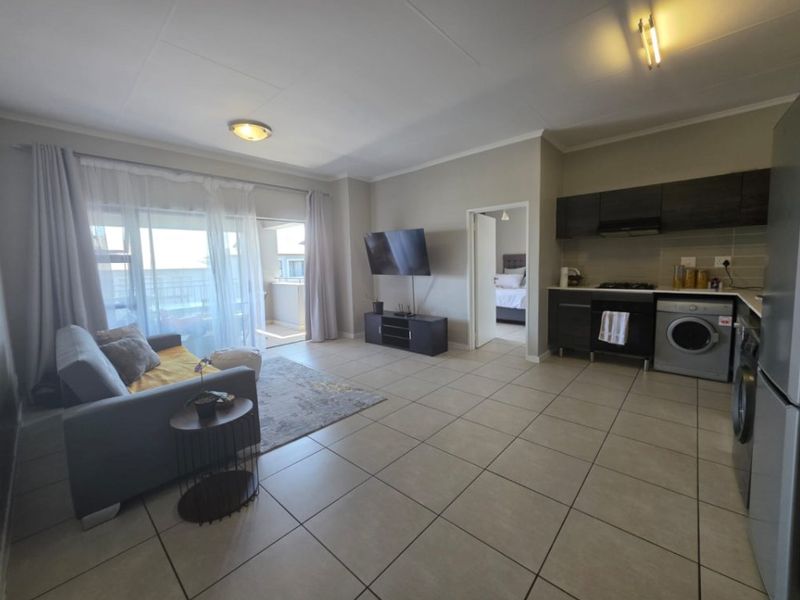 Modern 1-Bedroom Flat with Extended Balcony and Pool Access - Photo 2