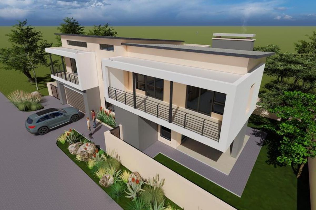 An aerial perspective of a modern two-story residential property featuring balconies, a garage, and landscaped exterior grounds.