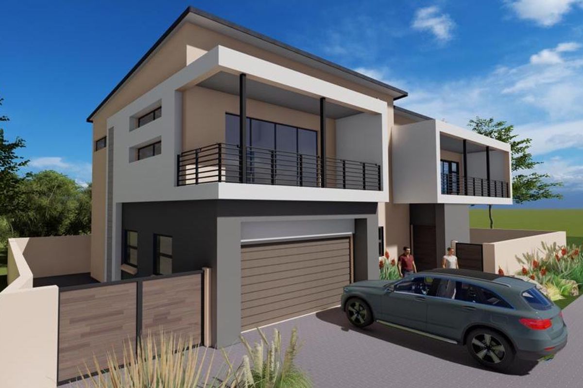 Modern double-story residential house featuring a double garage, upper-level balconies, and a secure boundary wall with a paved driveway.