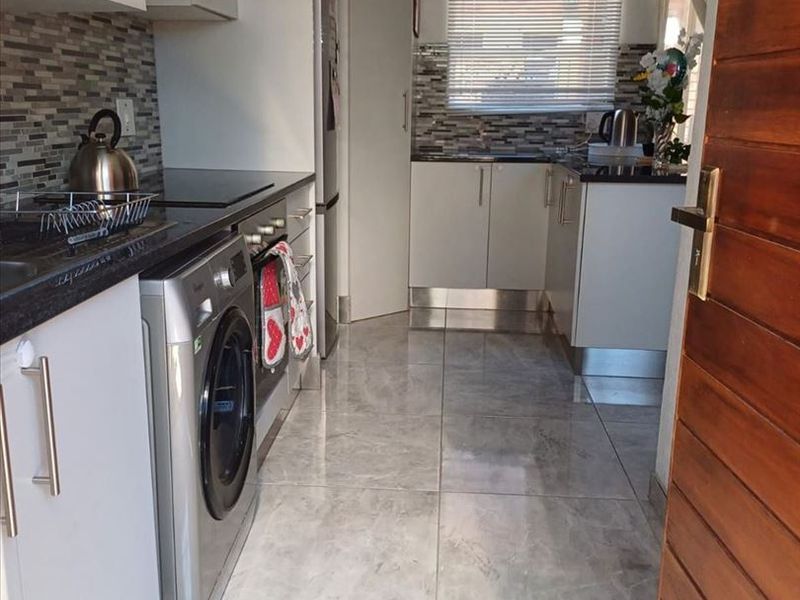 Charming Modern Home with Practical Living Spaces - Photo 2