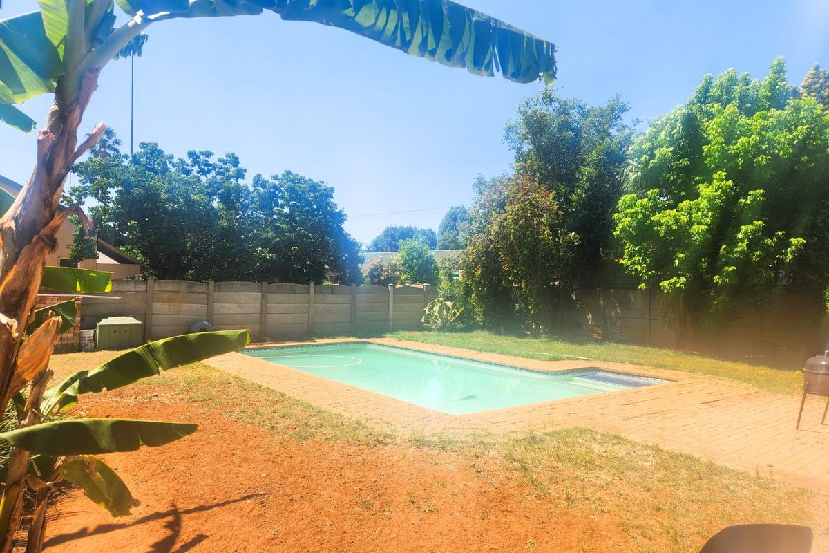A spacious 4-bedroom family home with 3 bathrooms, multiple living areas, an enclosed lapa, and a sparkling swimming pool—perfect for comfortable family living and entertaining. - Photo 4