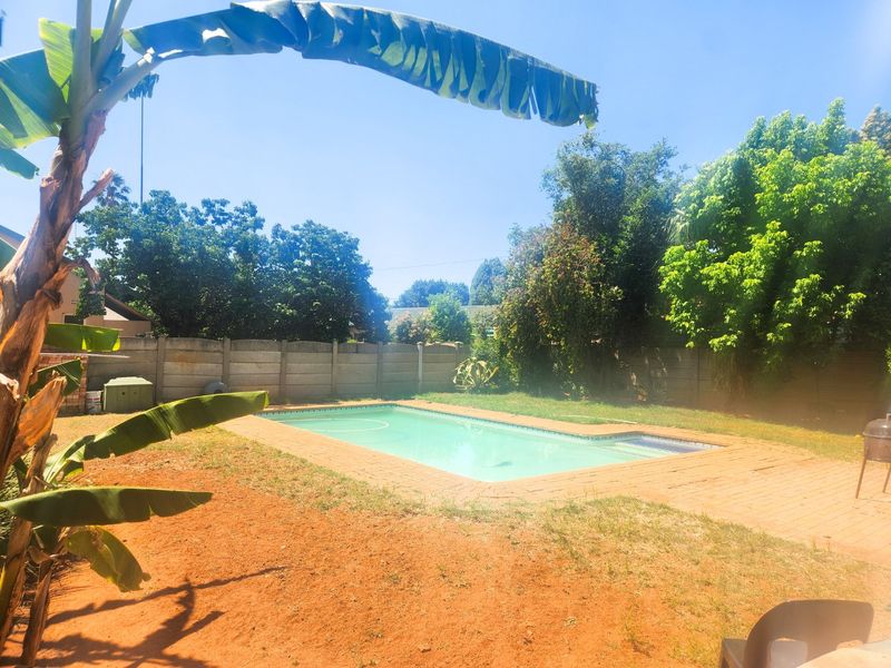 A spacious 4-bedroom family home with 3 bathrooms, multiple living areas, an enclosed lapa, and a sparkling swimming pool—perfect for comfortable family living and entertaining. - Photo 4