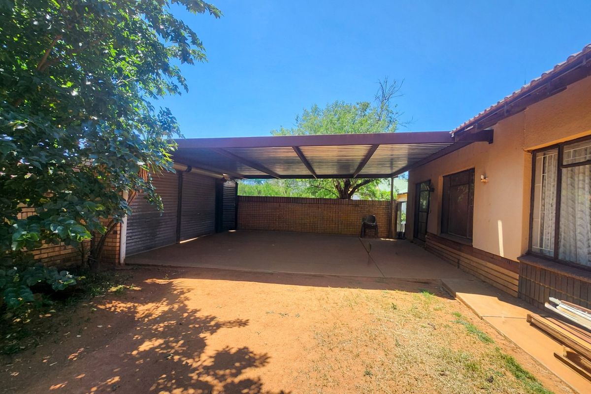 A spacious 4-bedroom family home with 3 bathrooms, multiple living areas, an enclosed lapa, and a sparkling swimming pool—perfect for comfortable family living and entertaining. - Photo 3