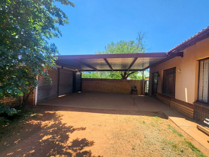 A spacious 4-bedroom family home with 3 bathrooms, multiple living areas, an enclosed lapa, and a sparkling swimming pool—perfect for comfortable family living and entertaining. - Photo 3