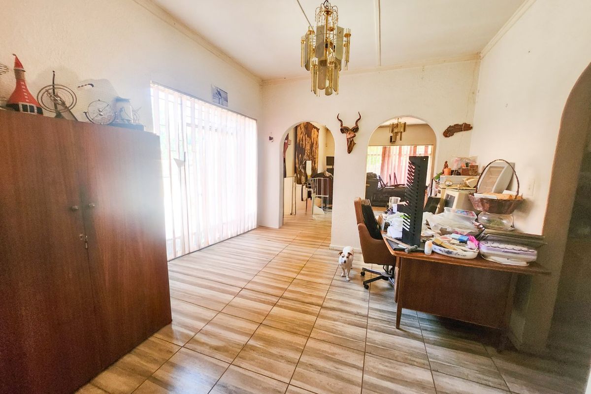 A spacious 4-bedroom family home with 3 bathrooms, multiple living areas, an enclosed lapa, and a sparkling swimming pool—perfect for comfortable family living and entertaining. - Photo 5