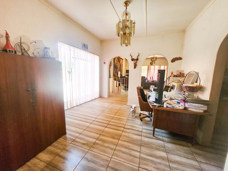 A spacious 4-bedroom family home with 3 bathrooms, multiple living areas, an enclosed lapa, and a sparkling swimming pool—perfect for comfortable family living and entertaining. - Photo 5