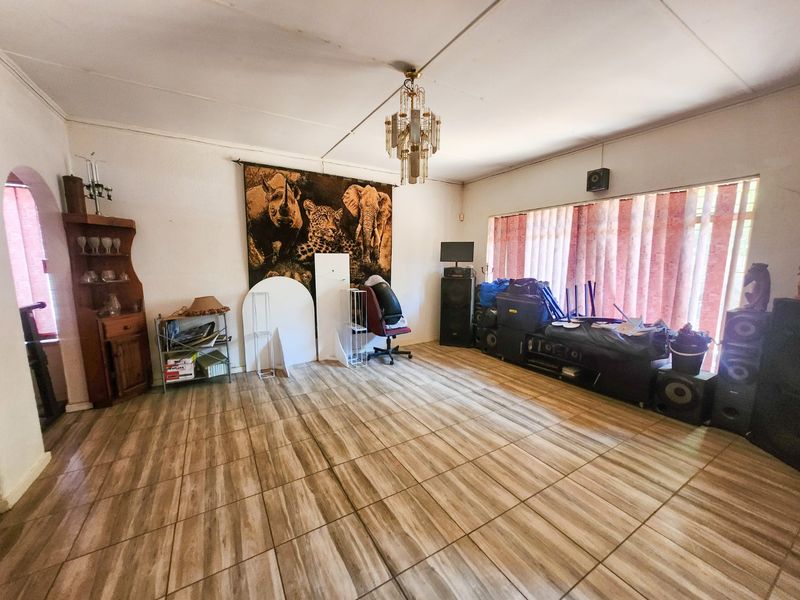 A spacious 4-bedroom family home with 3 bathrooms, multiple living areas, an enclosed lapa, and a sparkling swimming pool—perfect for comfortable family living and entertaining. - Photo 9