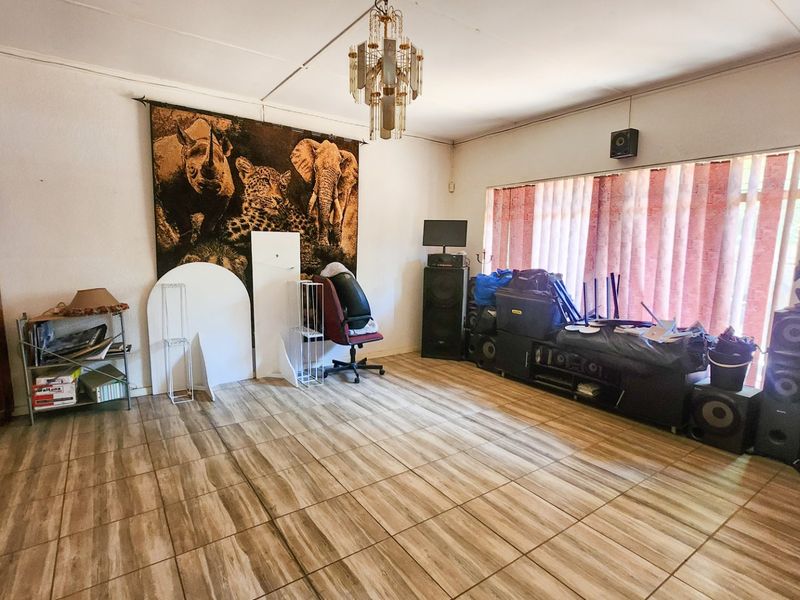 A spacious 4-bedroom family home with 3 bathrooms, multiple living areas, an enclosed lapa, and a sparkling swimming pool—perfect for comfortable family living and entertaining. - Photo 8