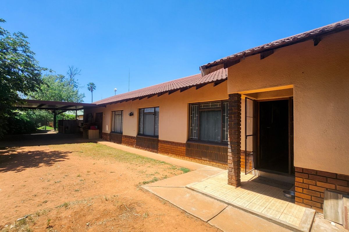 A spacious 4-bedroom family home with 3 bathrooms, multiple living areas, an enclosed lapa, and a sparkling swimming pool—perfect for comfortable family living and entertaining. - Photo 2