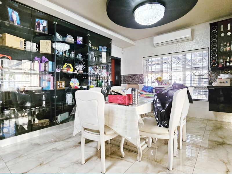 Dining room featuring built-in glass display cabinetry, a wine rack, tiled flooring, and a decorative recessed ceiling with integrated lighting.
