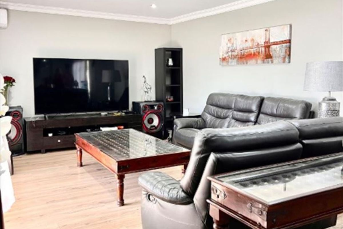 Elegant Five-Bedroom Home with Dual Kitchens and Spacious Living Areas - Photo 2