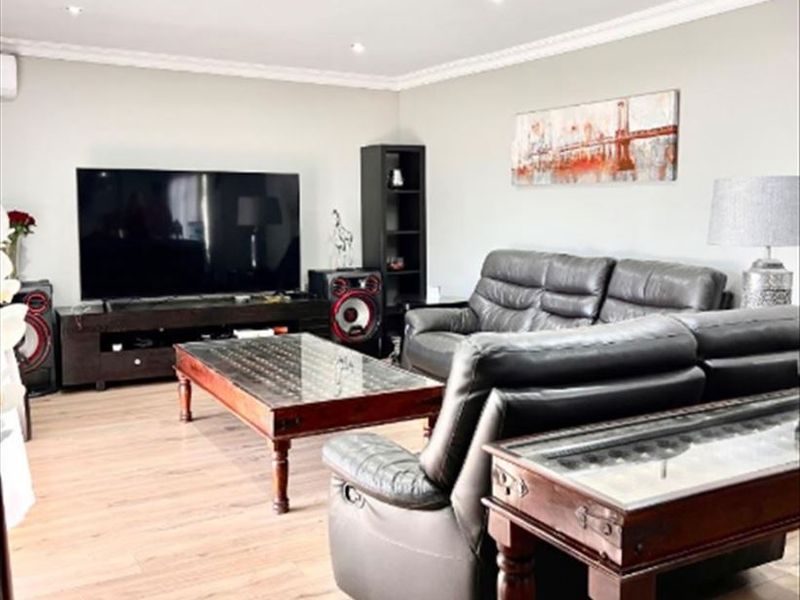 Elegant Five-Bedroom Home with Dual Kitchens and Spacious Living Areas - Photo 2