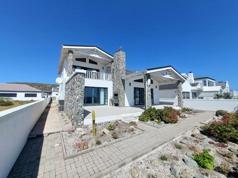 Modern Seaside Home with Panoramic Ocean Views in Sandy Point Estate - Photo 1