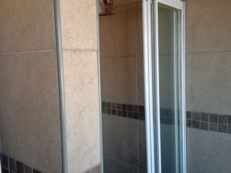 Spacious 3-Bedroom Home with Entertainment Area on Large Stand - Photo 9