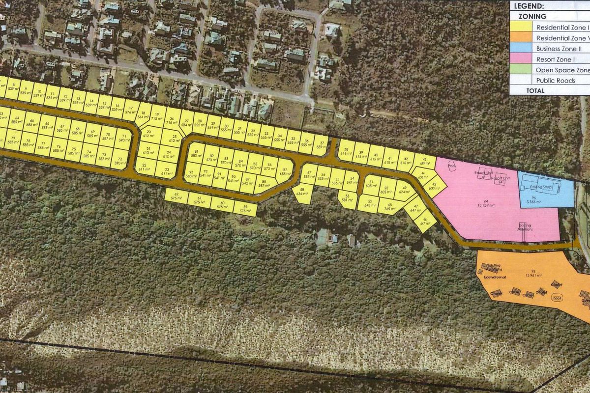 An aerial site development plan showing the layout of residential and commercial plots, zoning categories, and infrastructure within the estate.