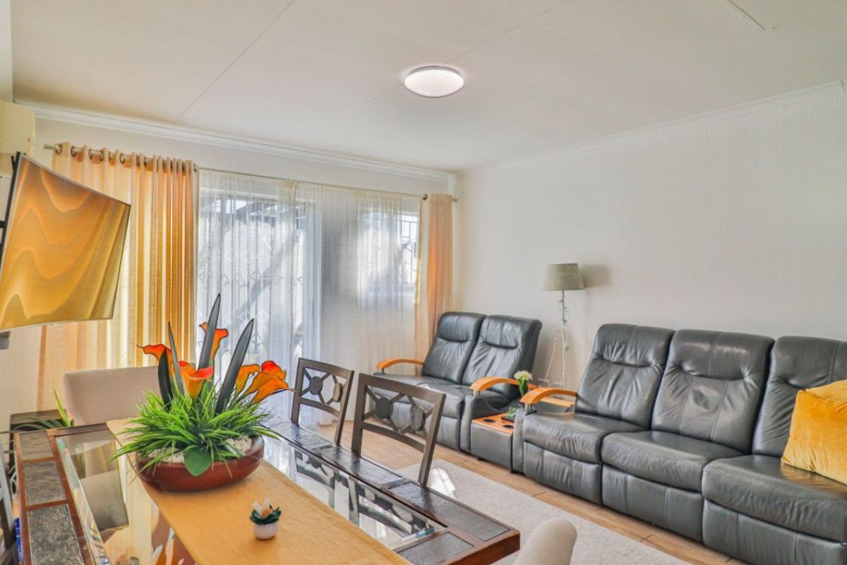 Open plan living and dining area featuring a sliding glass door providing natural light and access to the exterior.