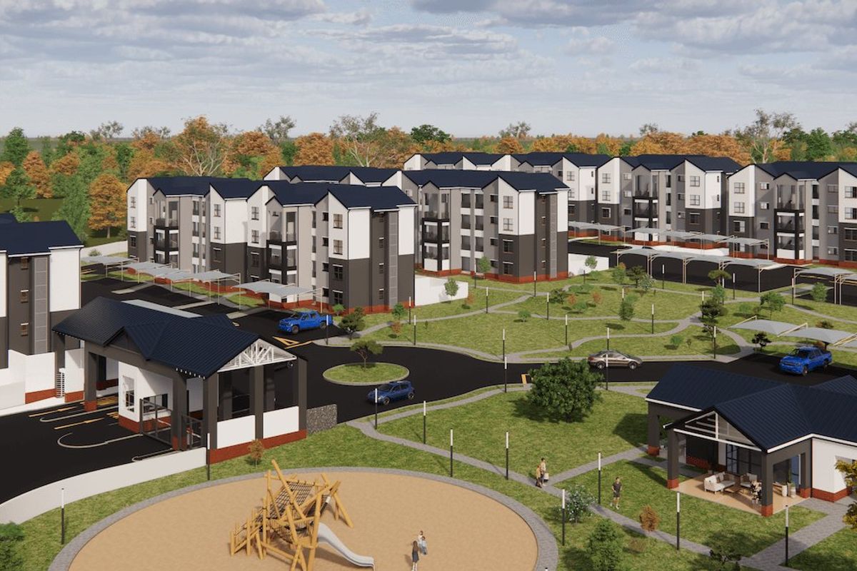 Aerial view of a modern townhouse development featuring multi-story residential blocks, landscaped communal gardens, a children's playground, and secure gated access.