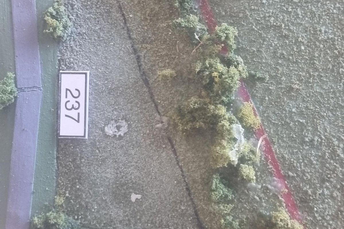 A physical scale model representing residential land plots 237 and 238.