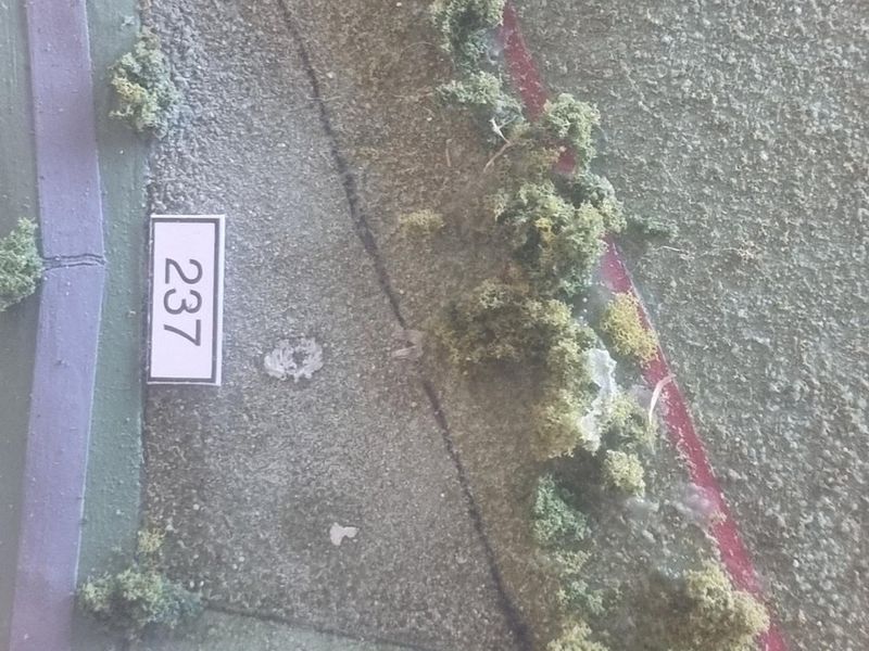 A physical scale model representing residential land plots 237 and 238.