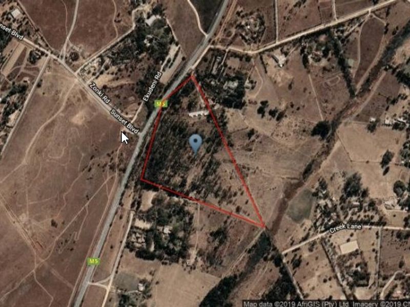 An aerial satellite view showing the property boundaries and surrounding rural landscape.