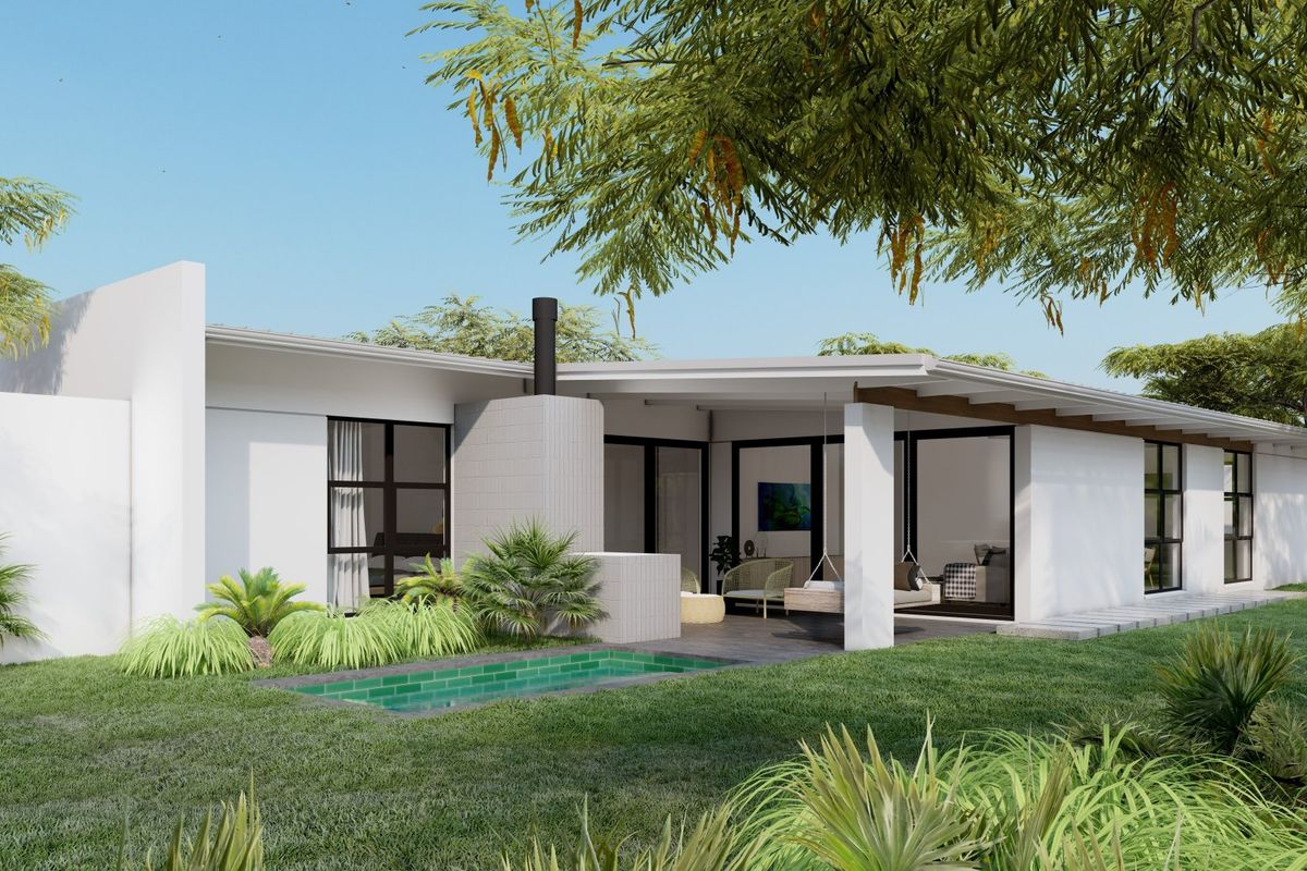 A modern rear exterior view featuring a covered patio, outdoor fireplace, and a small swimming pool set within a landscaped garden.