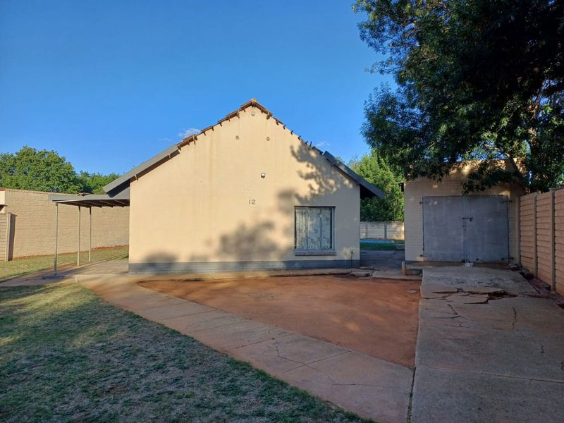 A Charming Family Home with Great Potential in Stilfontein Ext 4 - Photo 3