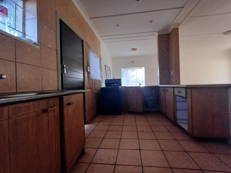 A Charming Family Home with Great Potential in Stilfontein Ext 4 - Photo 7