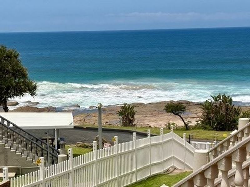 A Coastal Masterpiece — Stylish Beachfront Duplex with Panoramic Ocean Views - Photo 1