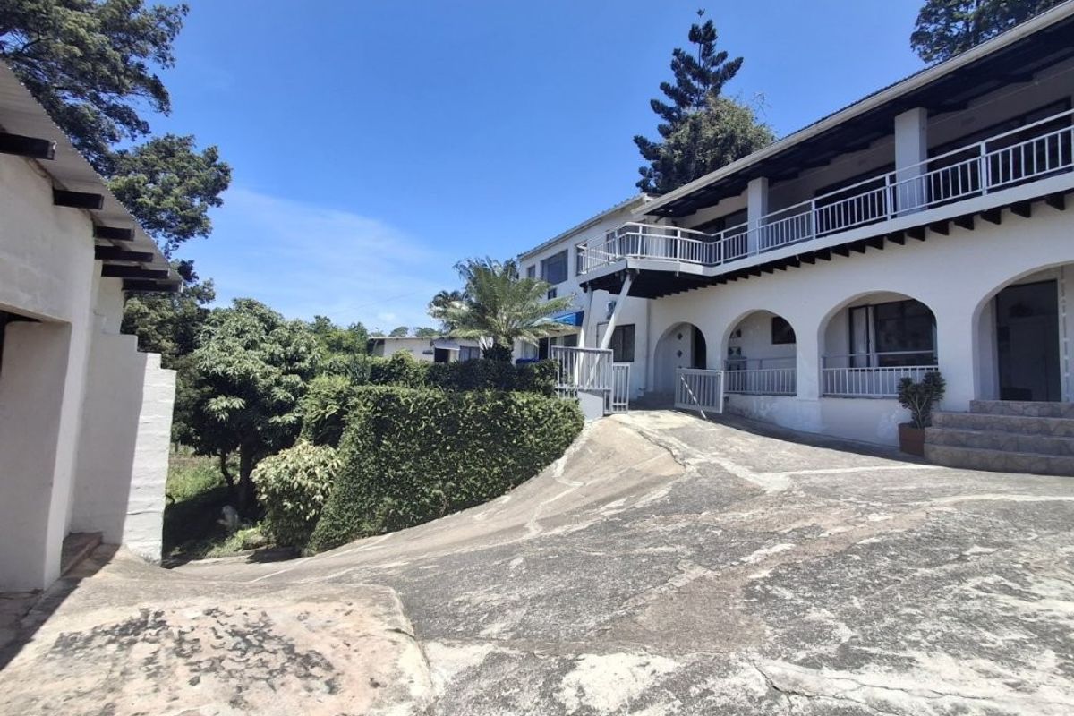 Unique 3-Bedroom Home With 7 Income Generating Flats. This is truly an investors Dream... - Photo 2