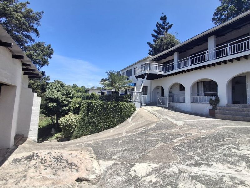 Unique 3-Bedroom Home With 7 Income Generating Flats. This is truly an investors Dream... - Photo 2