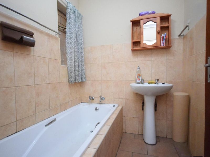 Neat 2-Bedroom Townhouse with Double-Volume Living Space in a Secure, Convenient Location - Photo 9