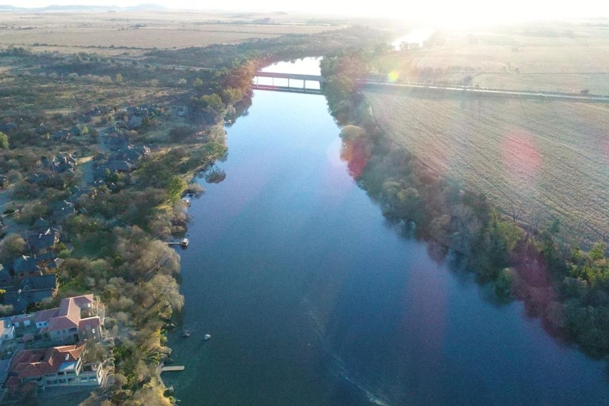 An aerial view of the property location, showcasing the riverfront setting and surrounding landscape.