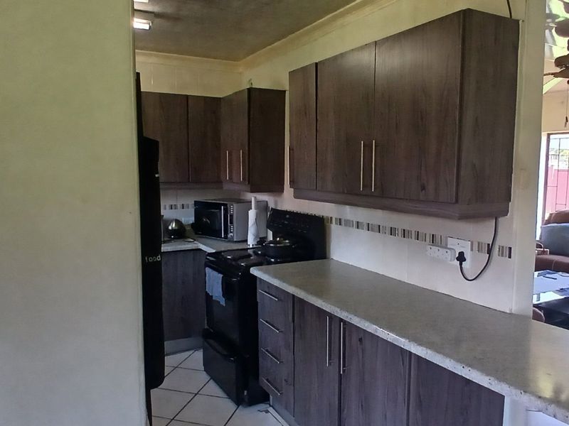 Dual Mandate - 3-Bedroom, 2-Bathroom Home for Sale - Photo 4