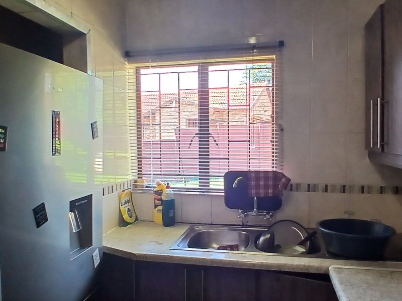 Dual Mandate - 3-Bedroom, 2-Bathroom Home for Sale - Photo 9