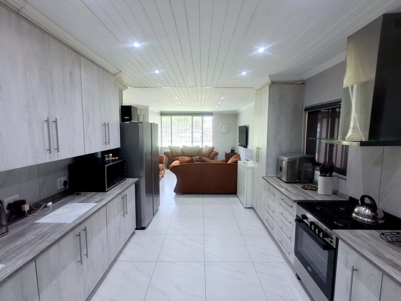 Modern, Spacious 3-Bedroom Home Perfectly Located on a Corner Stand with Endless Potential - Photo 6