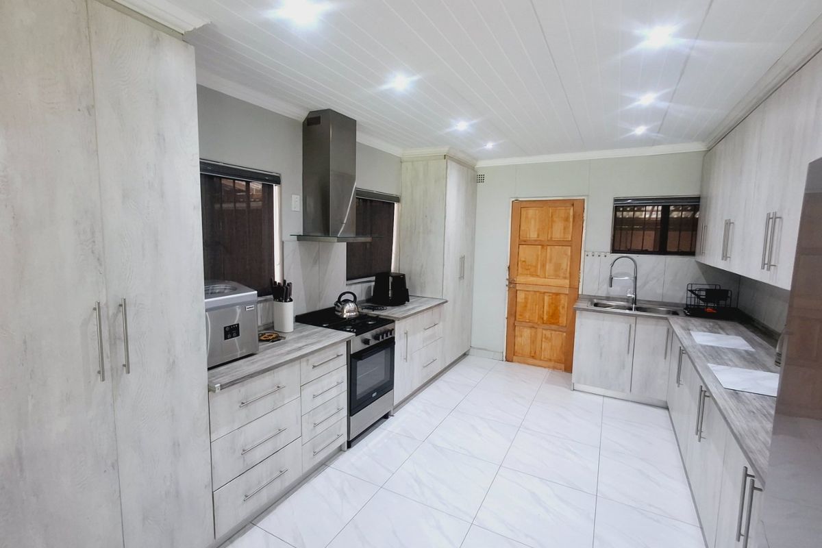 Modern, Spacious 3-Bedroom Home Perfectly Located on a Corner Stand with Endless Potential - Photo 2